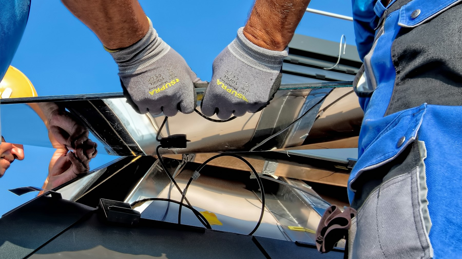 Technicians installing solar panels